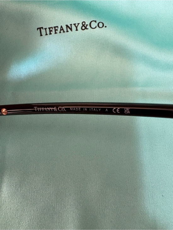 Tiffany & Co. TF3104D Women\'s Black Oval Rimless Sunglasses with Gold Accents